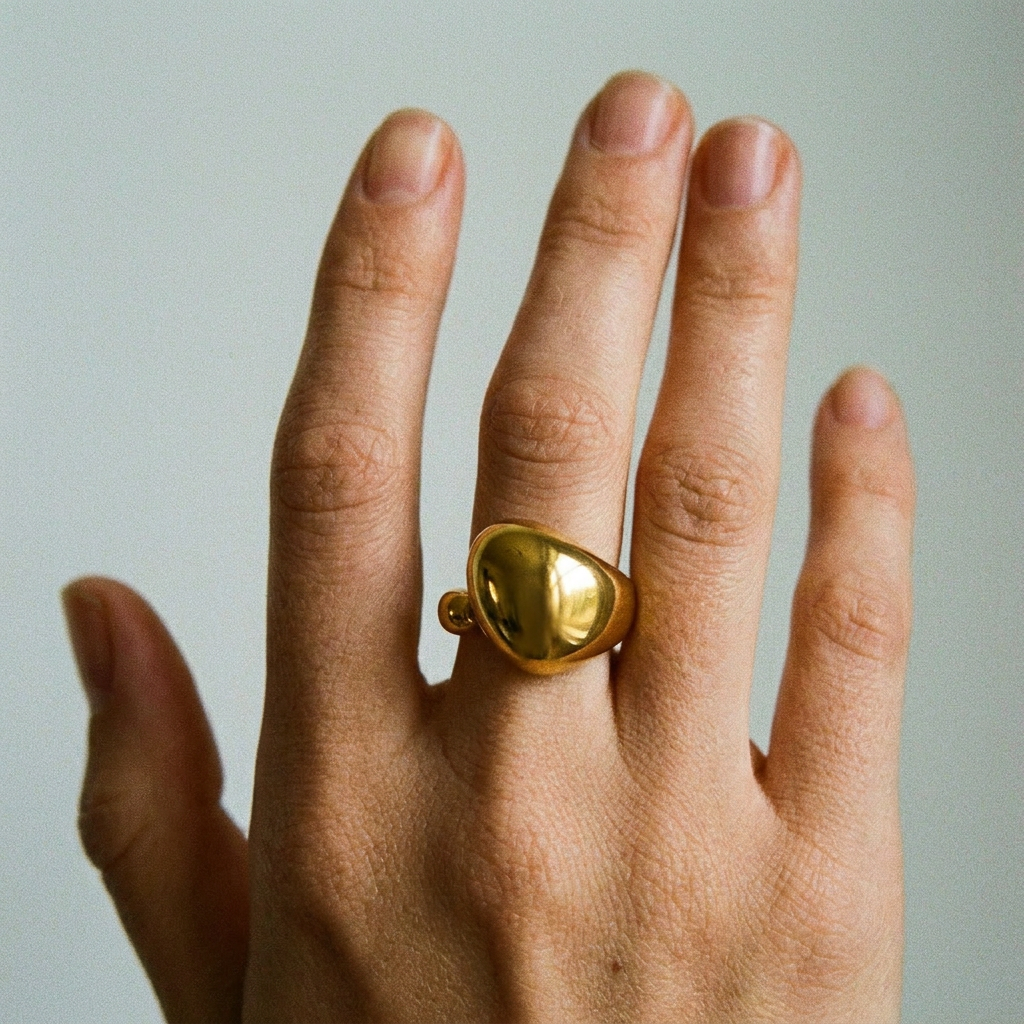 ANILLO DE ACERO DORADO GOTA ABIERTO