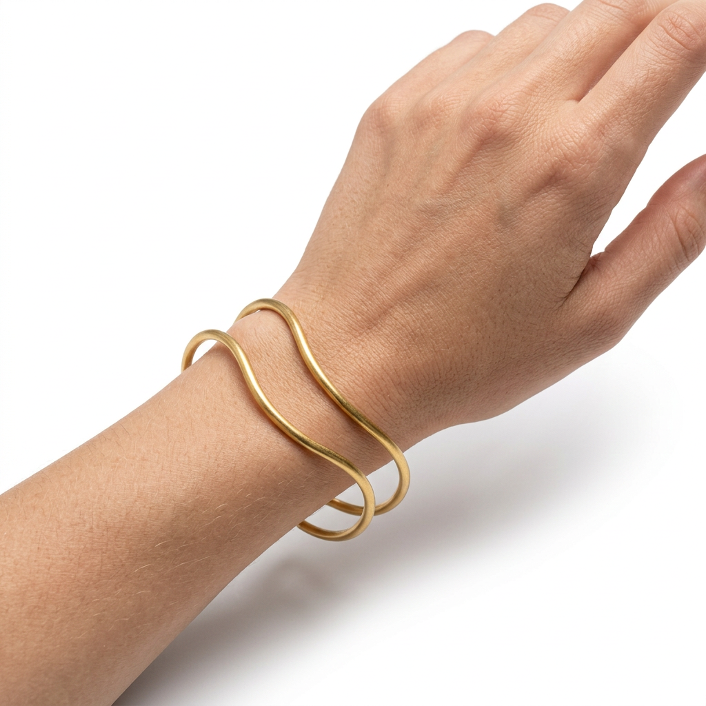 PULSERA DE ACERO DORADO CUFF ONDULADA