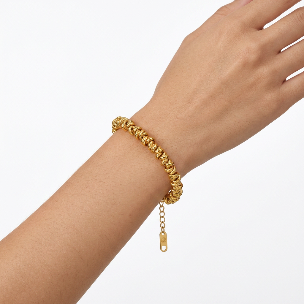 PULSERA DE ACERO DORADO ARACOS ENTRELAZADOS